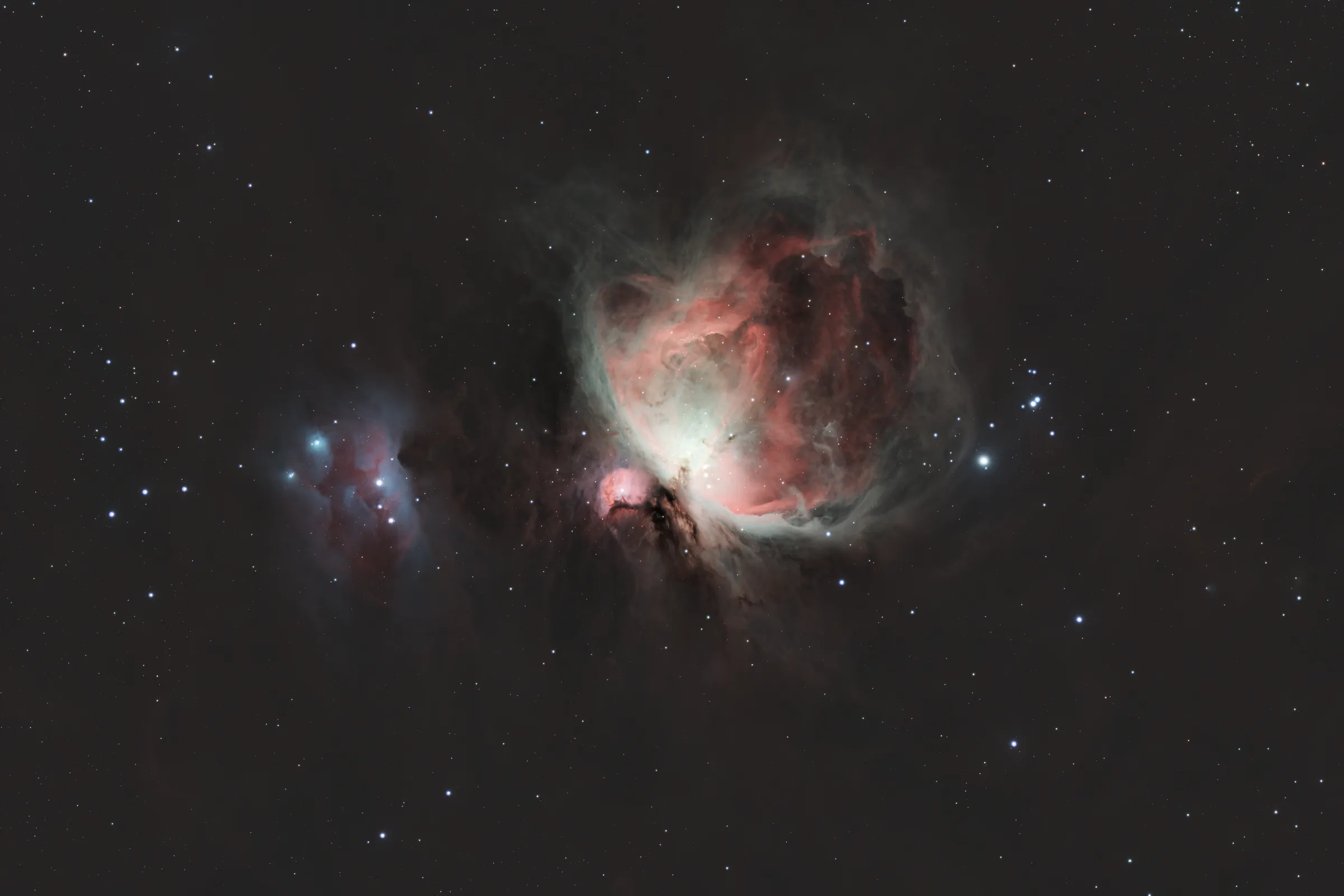 The Orion Nebula, a bright star-forming region with the Trapezium cluster at its core.
